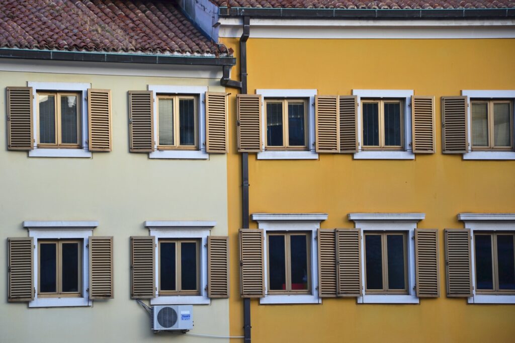 a yellow building with windows