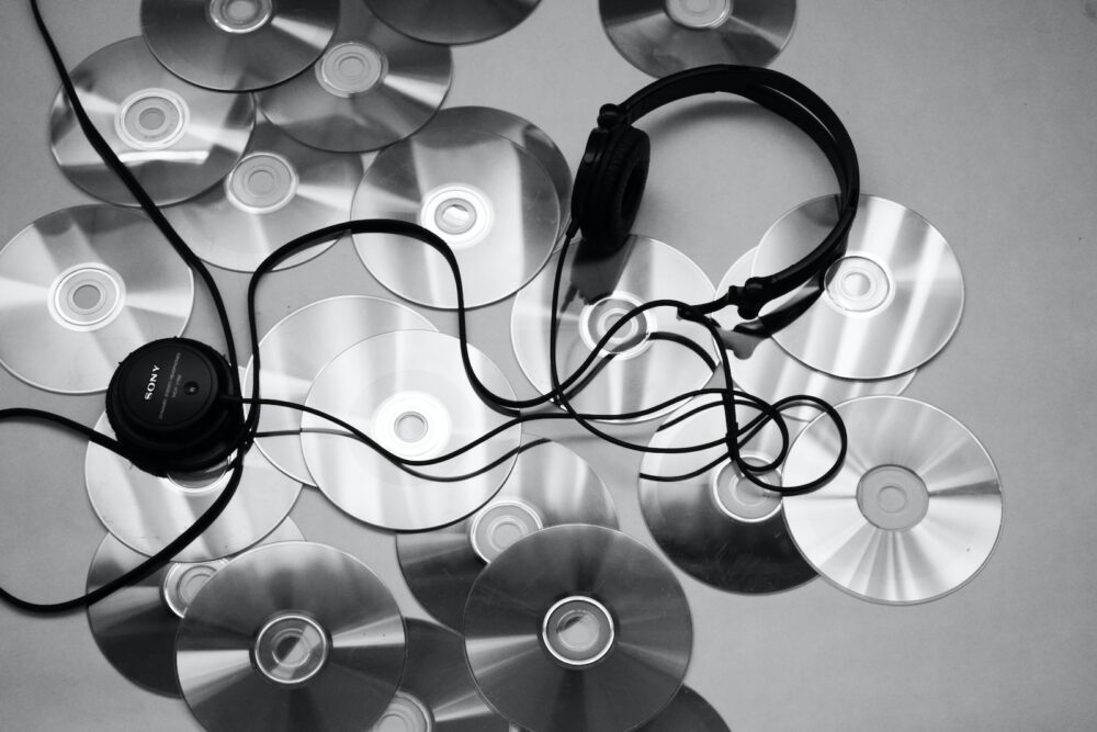 black corded headphones on white surface