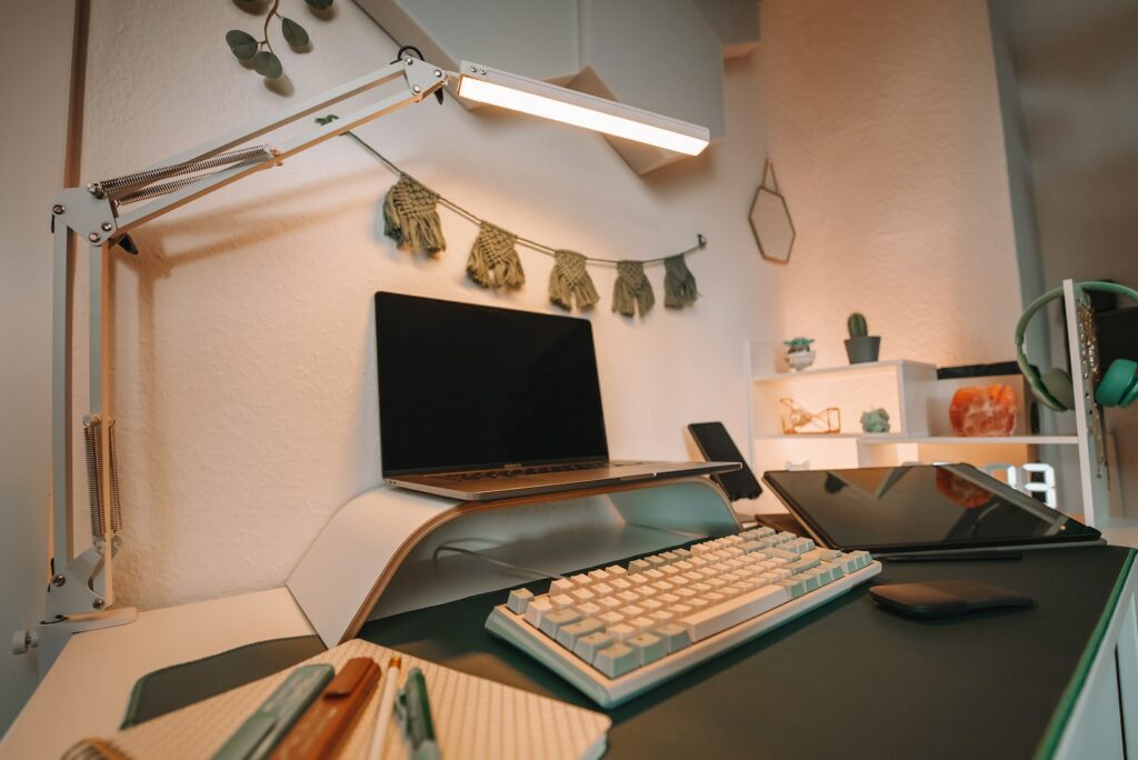 a computer desk with a keyboard and monitor