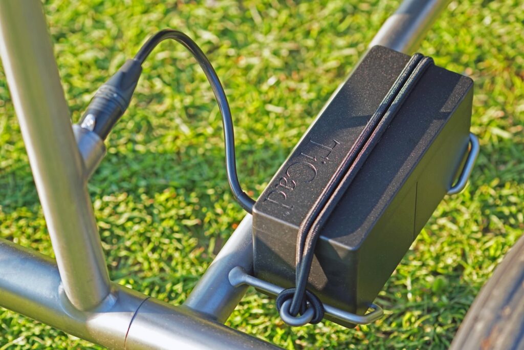 a close up of a bike with a charger attached to it